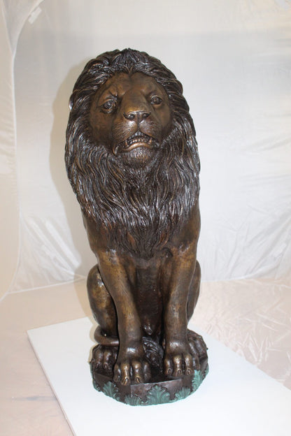 Lion Sitting on Base Bronze Statue -  Size: 13"L x 13"W x 34"H. 