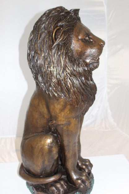 Lion Sitting on Base Bronze Statue -  Size: 13"L x 13"W x 34"H. 