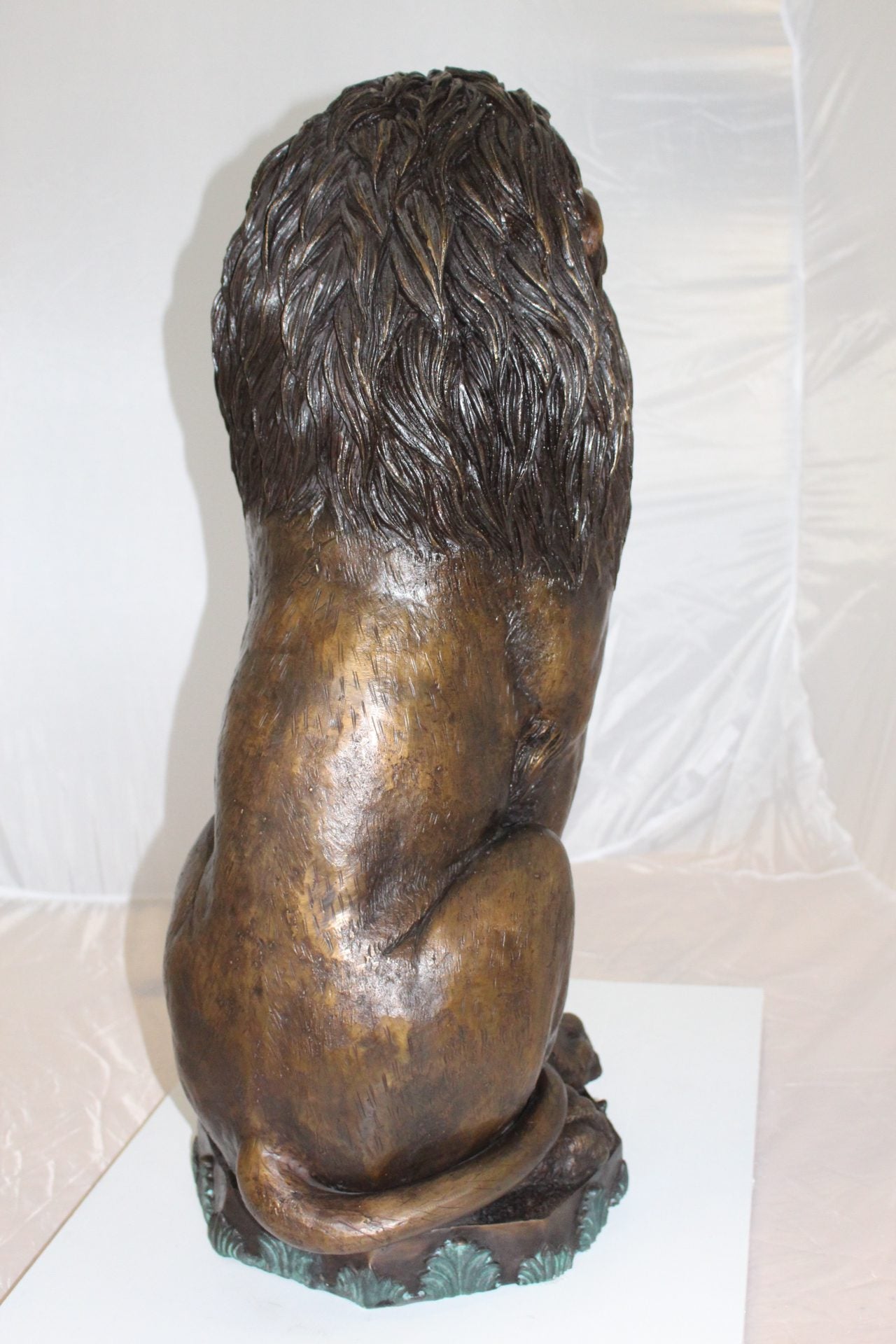 Lion Sitting on Base Bronze Statue -  Size: 13"L x 13"W x 34"H. 