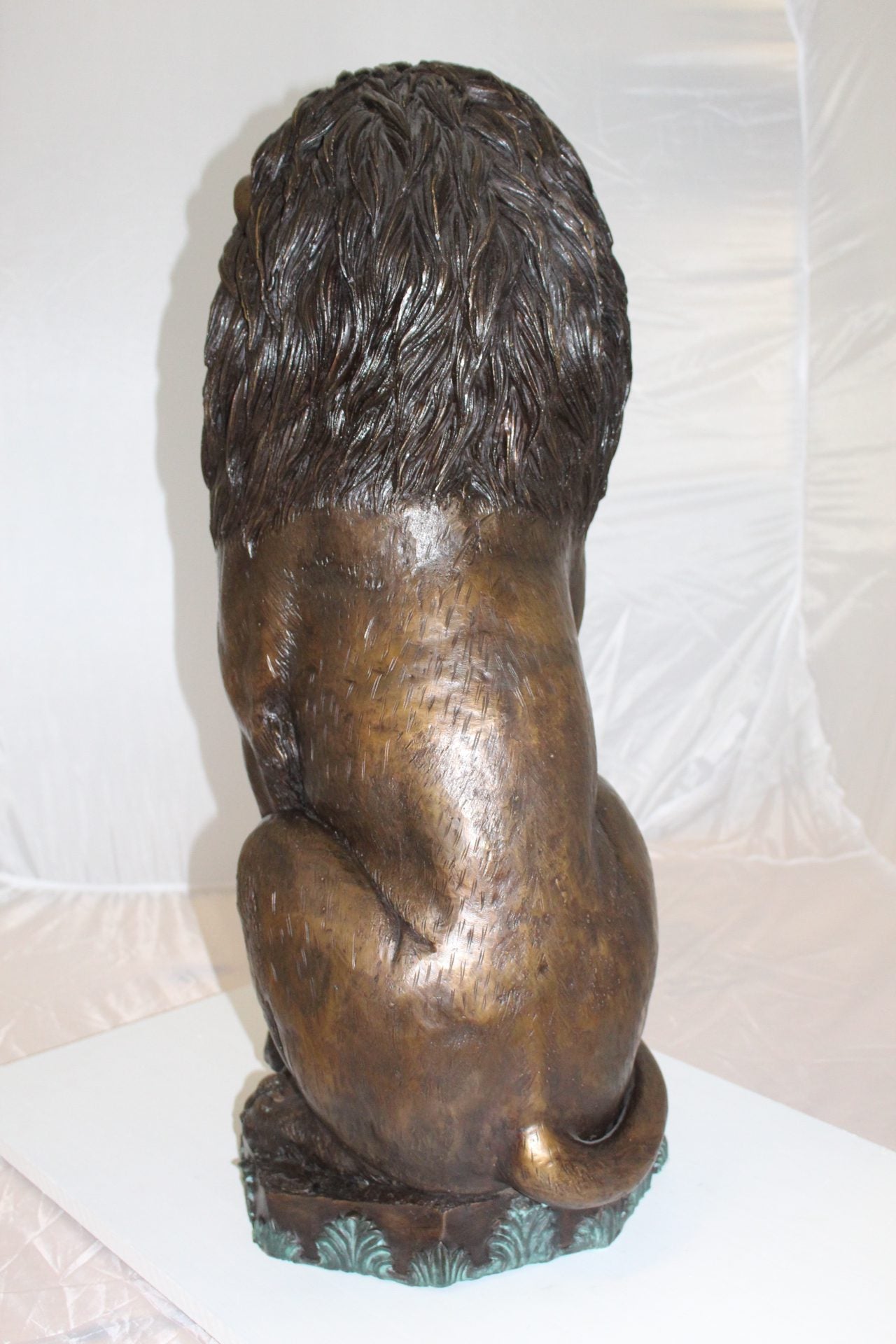 Lion Sitting on Base Bronze Statue -  Size: 13"L x 13"W x 34"H. 