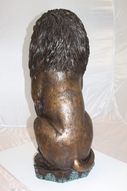 Lion Sitting on Base Bronze Statue -  Size: 13"L x 13"W x 34"H. 