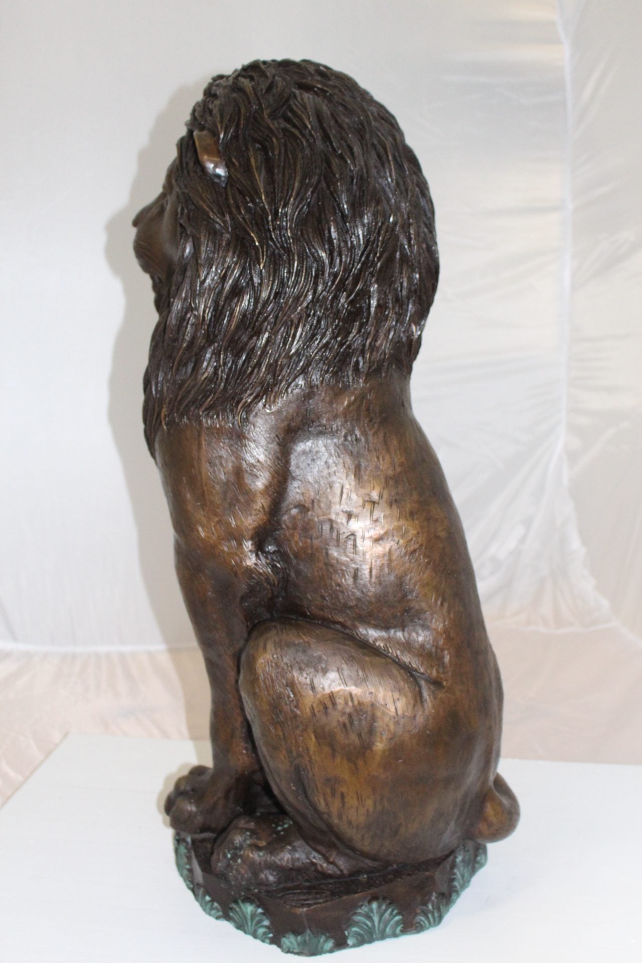 Lion Sitting on Base Bronze Statue -  Size: 13"L x 13"W x 34"H. 