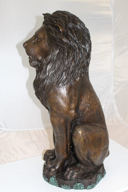 Lion Sitting on Base Bronze Statue -  Size: 13"L x 13"W x 34"H. 