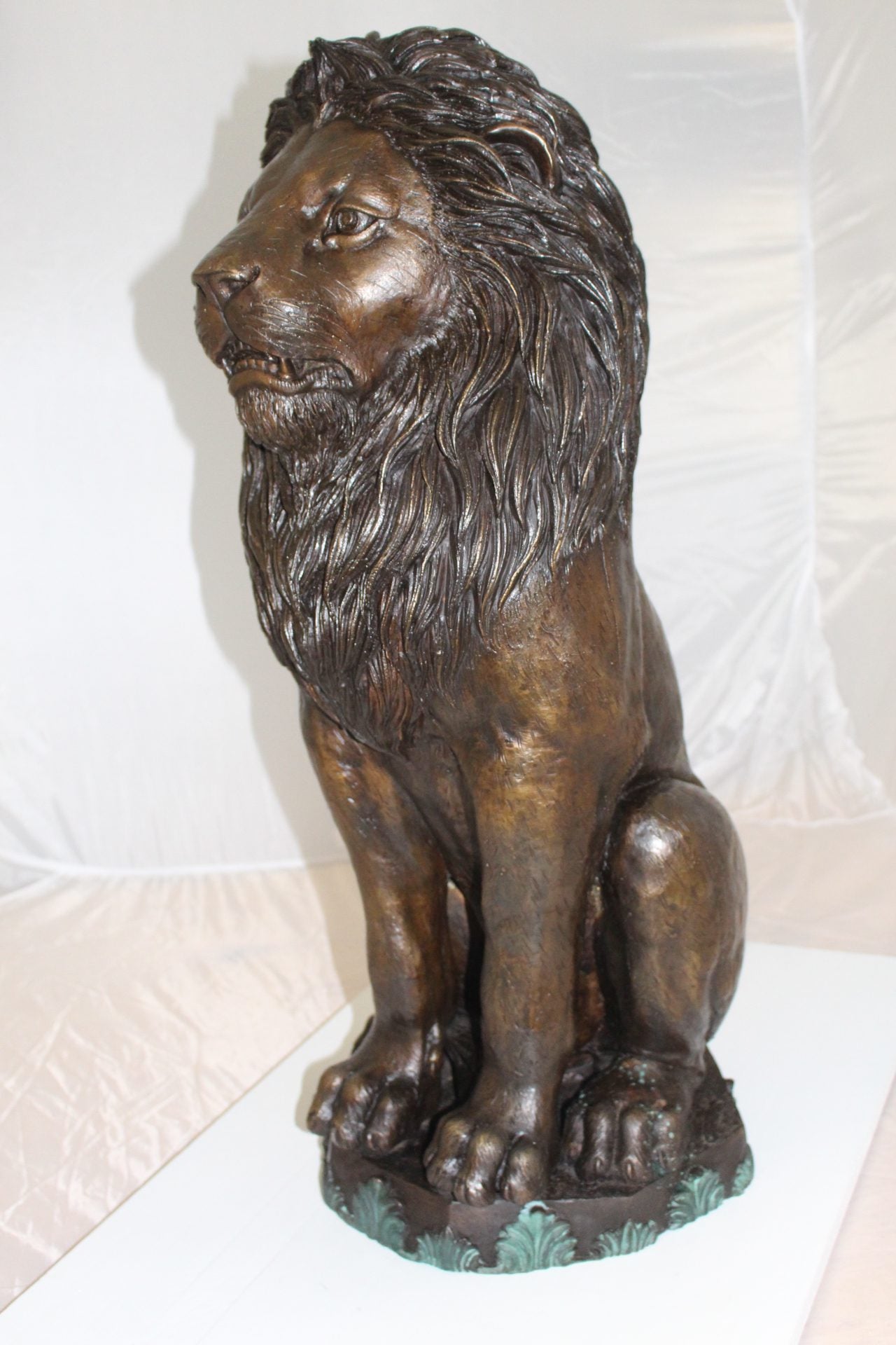 Lion Sitting on Base Bronze Statue -  Size: 13"L x 13"W x 34"H. 
