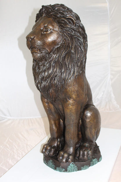 Lion Sitting on Base Bronze Statue -  Size: 13"L x 13"W x 34"H. 