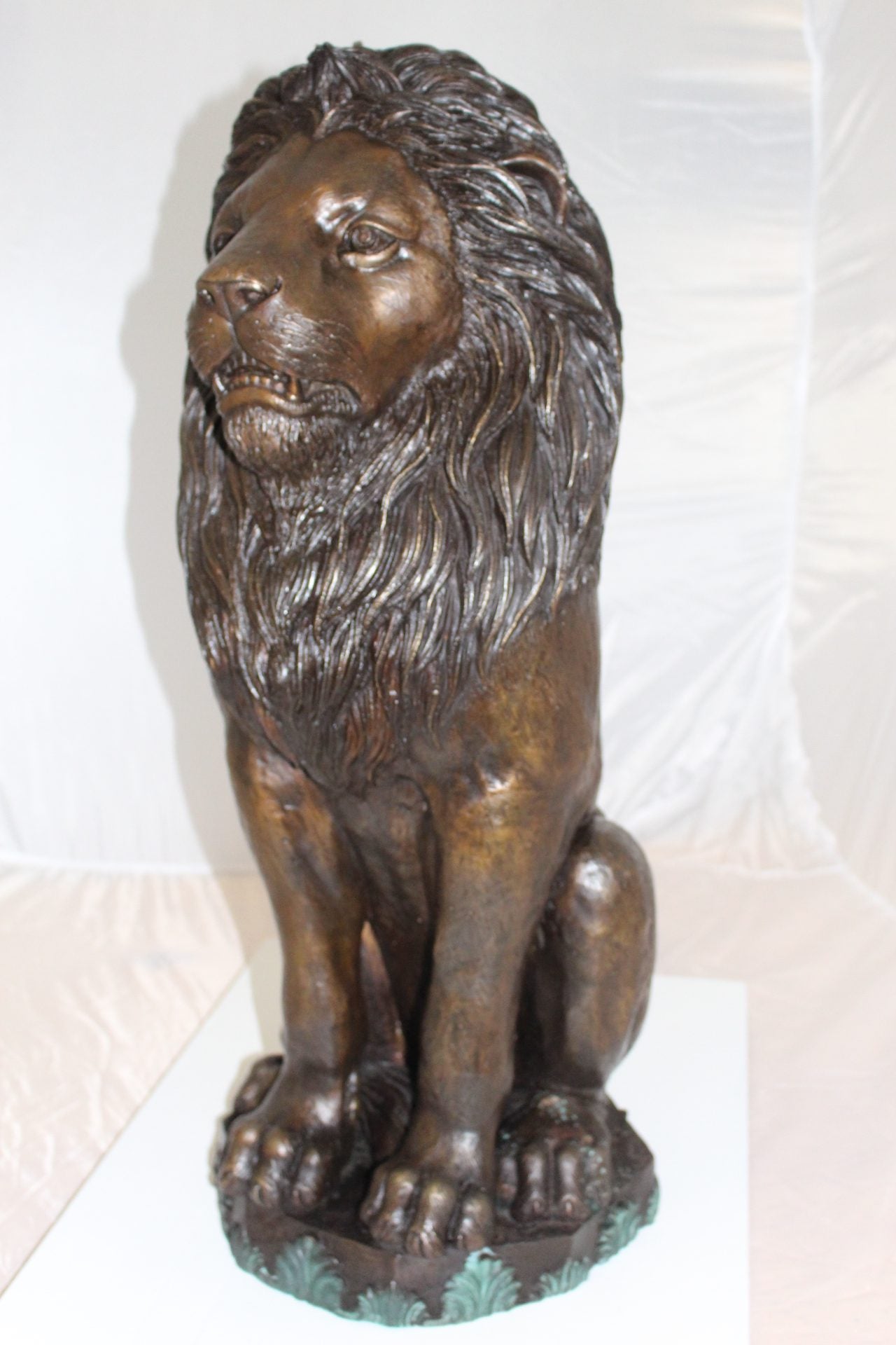 Lion Sitting on Base Bronze Statue -  Size: 13"L x 13"W x 34"H. 