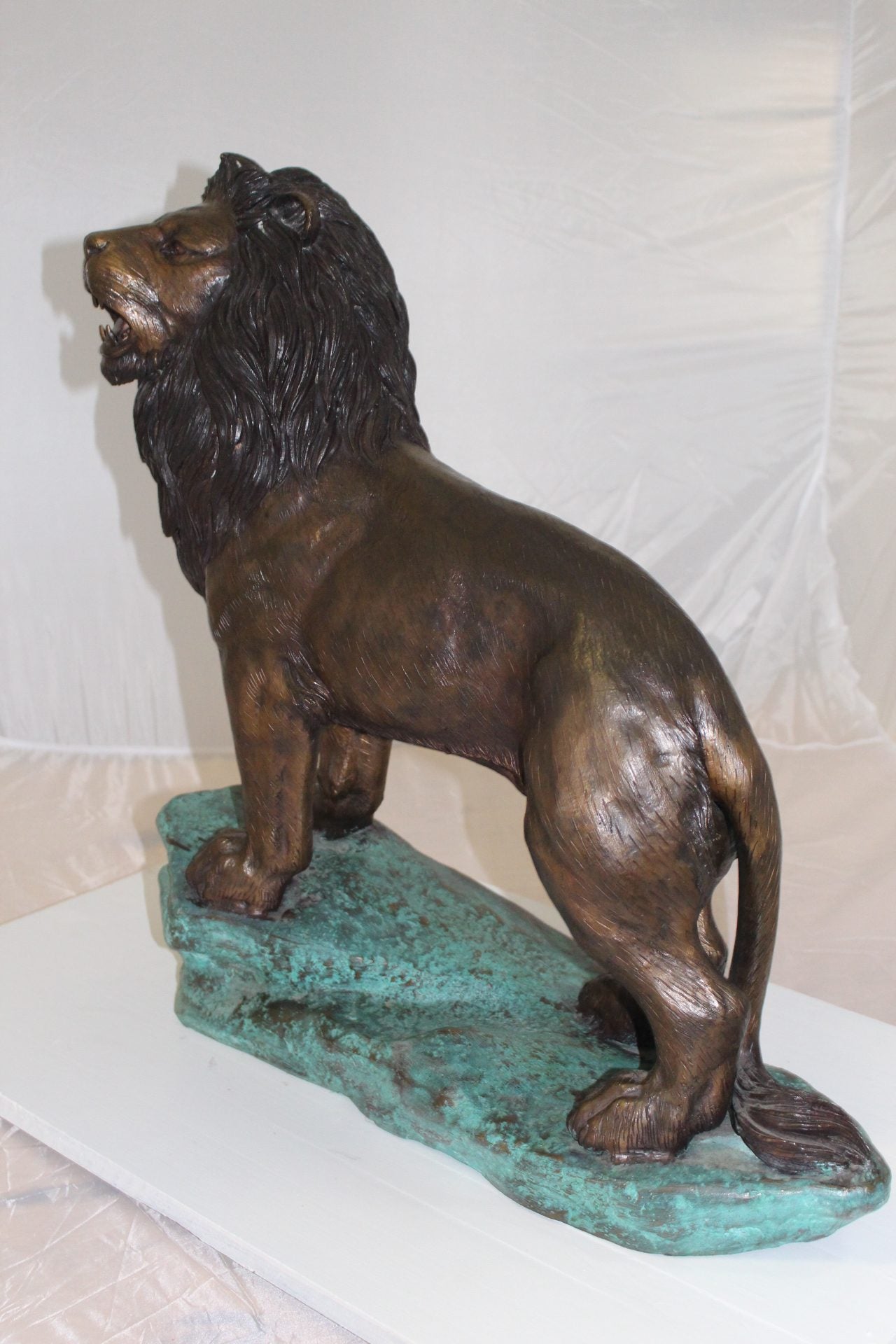 Lion Standing Bronze Statue -  Size: 26"L x 10"W x 25"H. 