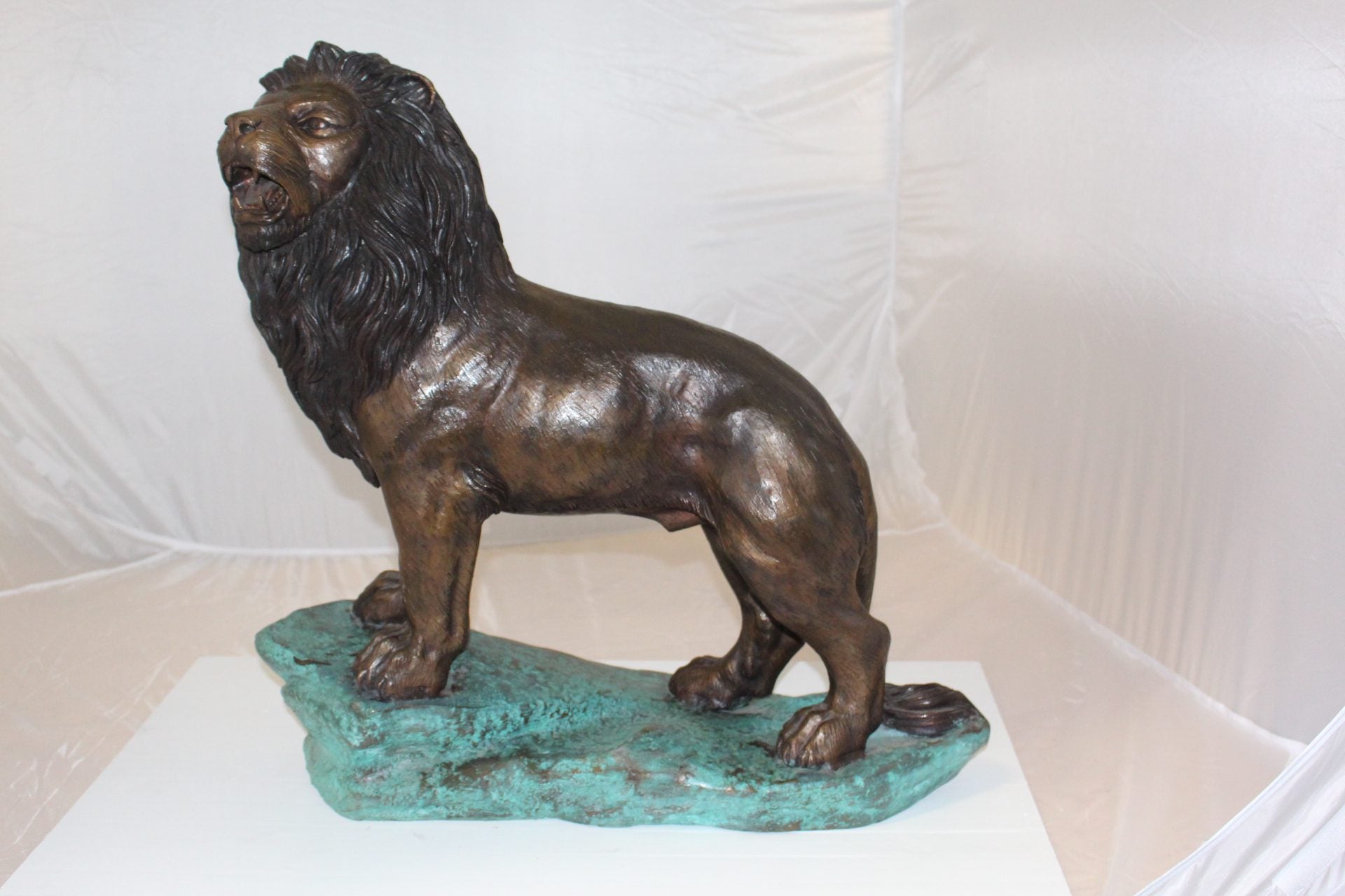 Lion Standing Bronze Statue -  Size: 26"L x 10"W x 25"H. 