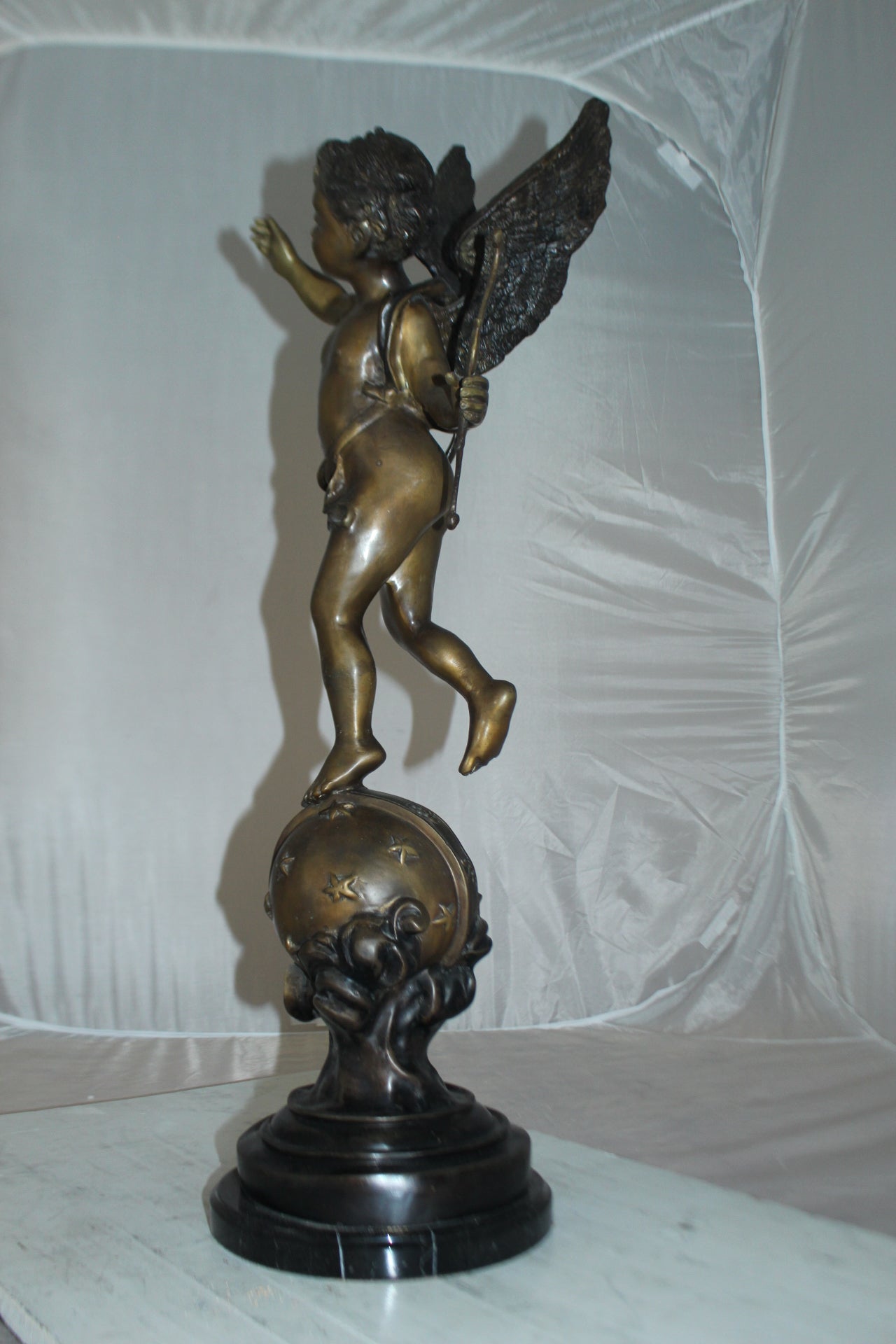 Angel on Earth Bronze Statue -  Size: 10"L x 13"W x 32"H. 
