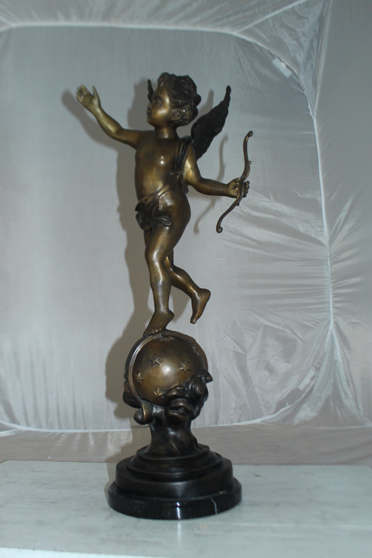 Angel on Earth Bronze Statue -  Size: 10"L x 13"W x 32"H. 