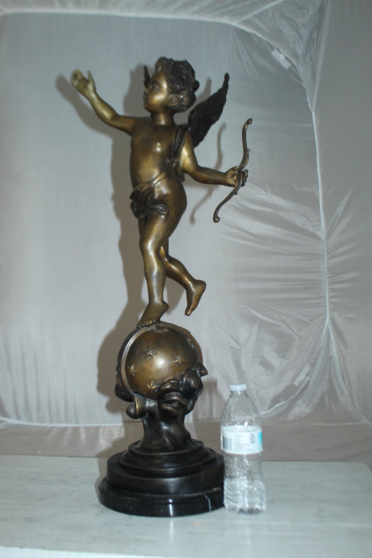 Angel on Earth Bronze Statue -  Size: 10"L x 13"W x 32"H. 