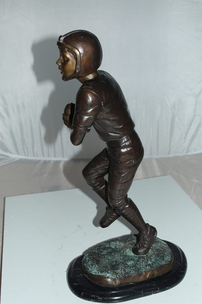 Boy playing football Bronze Statue -  Size: 10"L x 8"W x 20"H. 