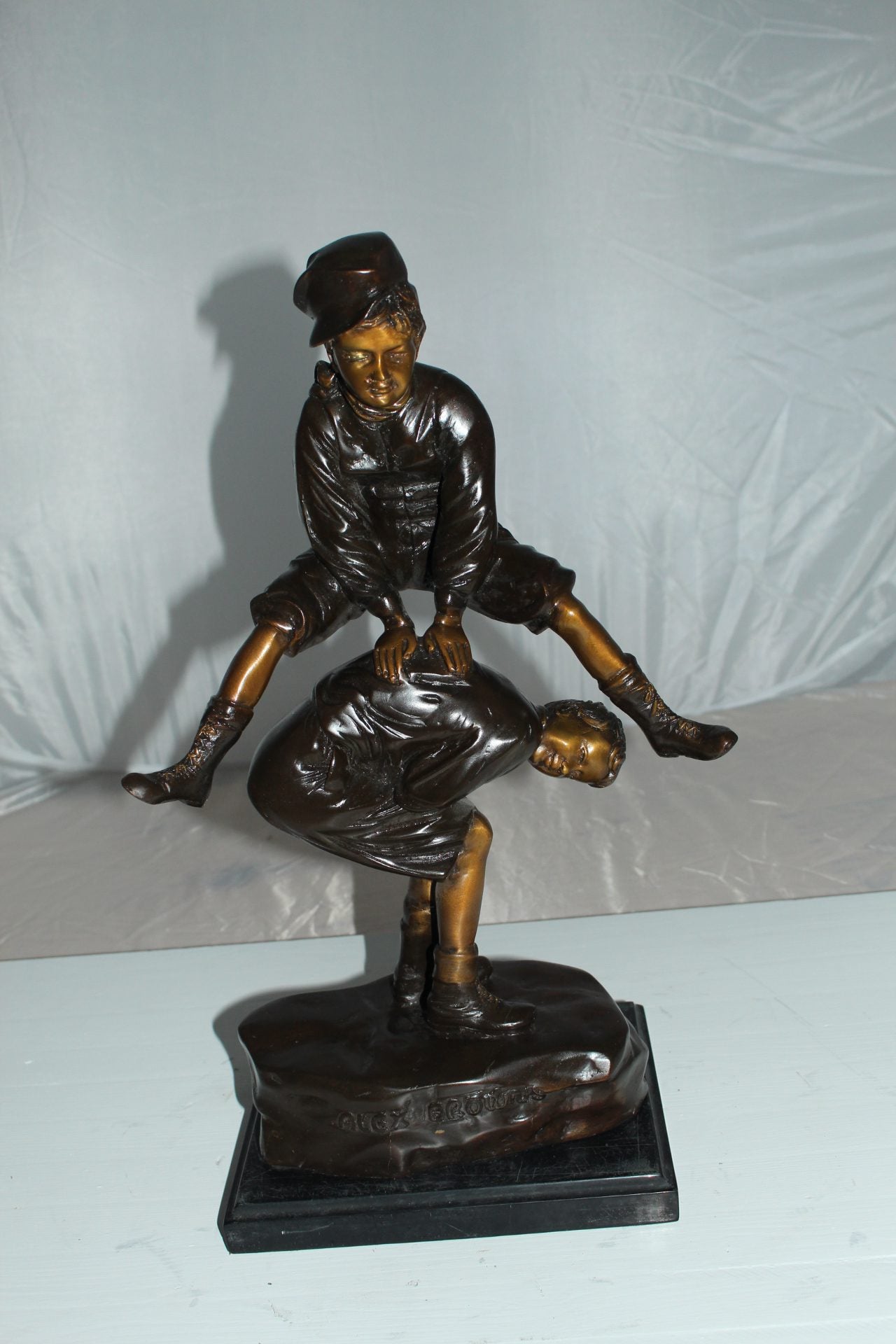 Leapfrog Bronze Statue -  Size: 12"L x 7"W x 19"H. 