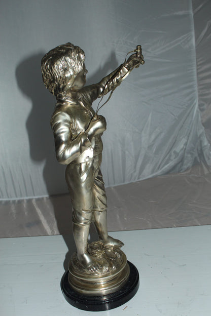 Boy with a Sling Bronze Statue -  Size: 10"L x 6.5"W x 21.5"H. 