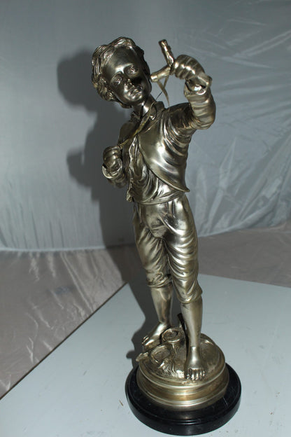 Boy with a Sling Bronze Statue -  Size: 10"L x 6.5"W x 21.5"H. 
