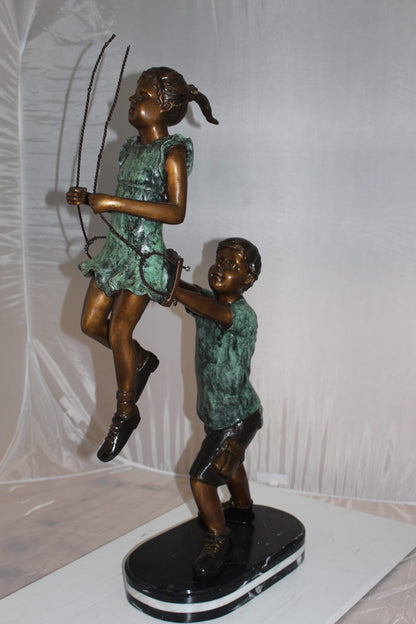 Children-on-swing-Bronze-Statue -  Size: 20"L x 9"W x 39"H. 