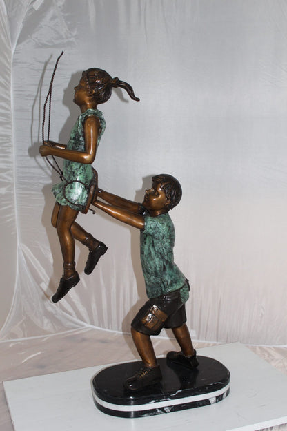 Children-on-swing-Bronze-Statue -  Size: 20"L x 9"W x 39"H. 