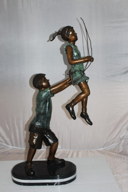 Children-on-swing-Bronze-Statue -  Size: 20"L x 9"W x 39"H. 