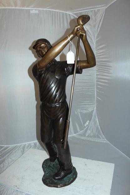 Teen boy plays golf Bronze Statue -  Size: 18"L x 13"W x 57"H. 