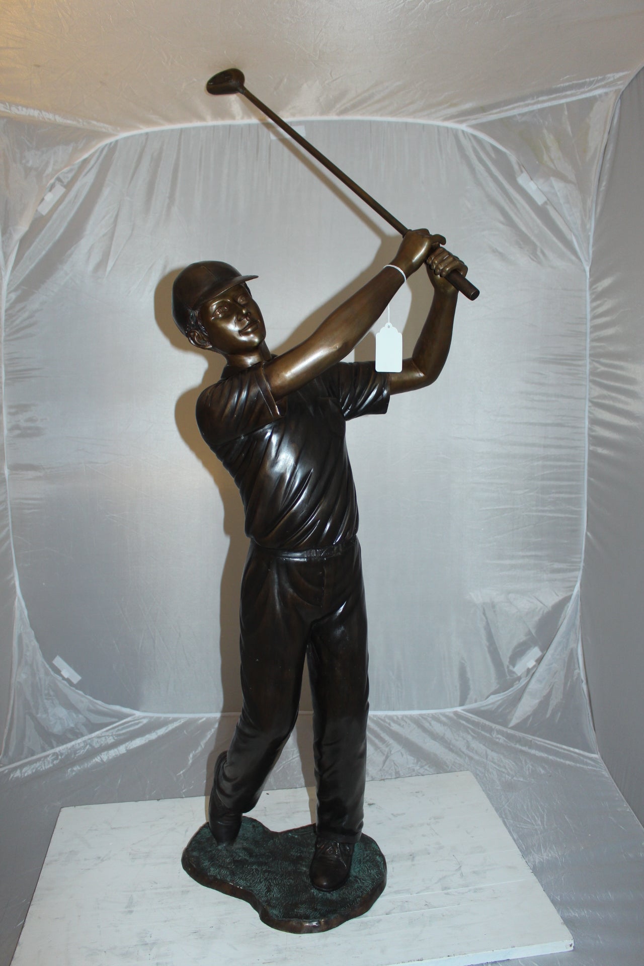 Teen boy plays golf Bronze Statue -  Size: 18"L x 13"W x 57"H. 