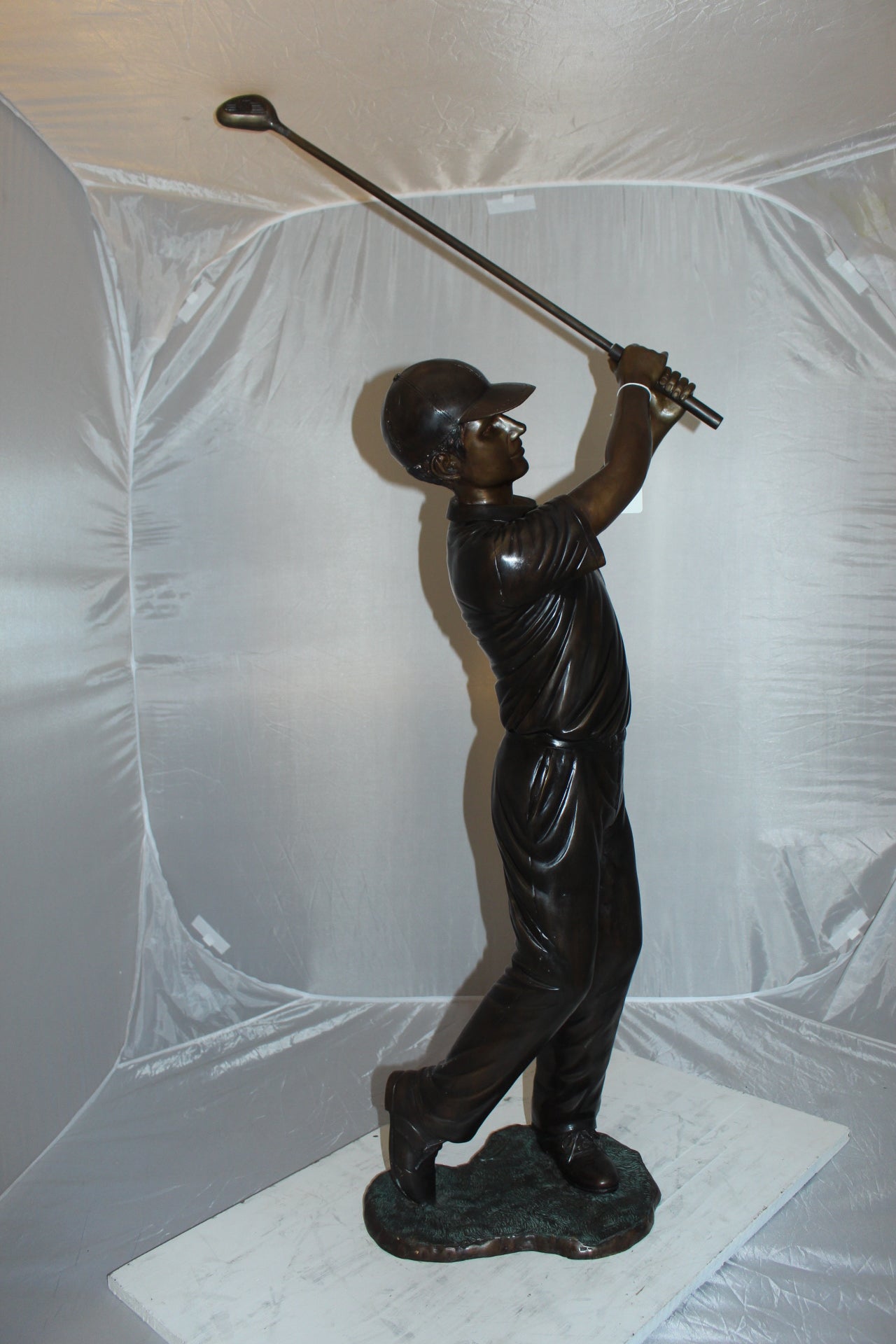 Teen boy plays golf Bronze Statue -  Size: 18"L x 13"W x 57"H. 