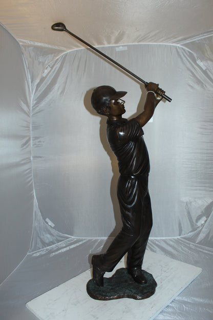 Teen boy plays golf Bronze Statue -  Size: 18"L x 13"W x 57"H. 