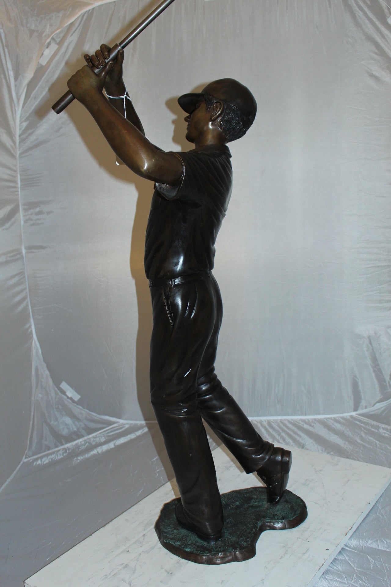 Teen boy plays golf Bronze Statue -  Size: 18"L x 13"W x 57"H. 