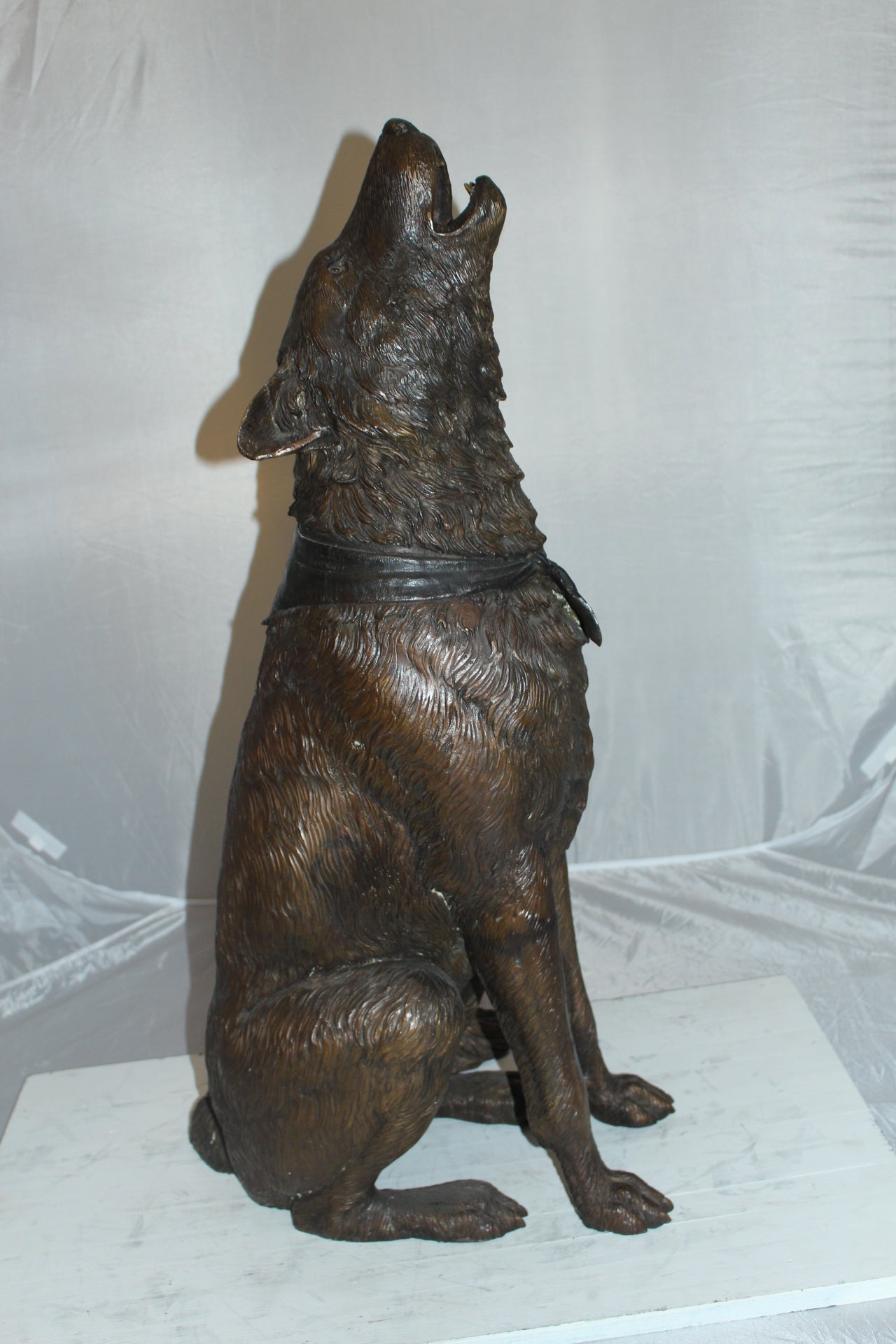 Howling Wolf Bronze Statue -  Size: 16"L x 20"W x 37"H. 