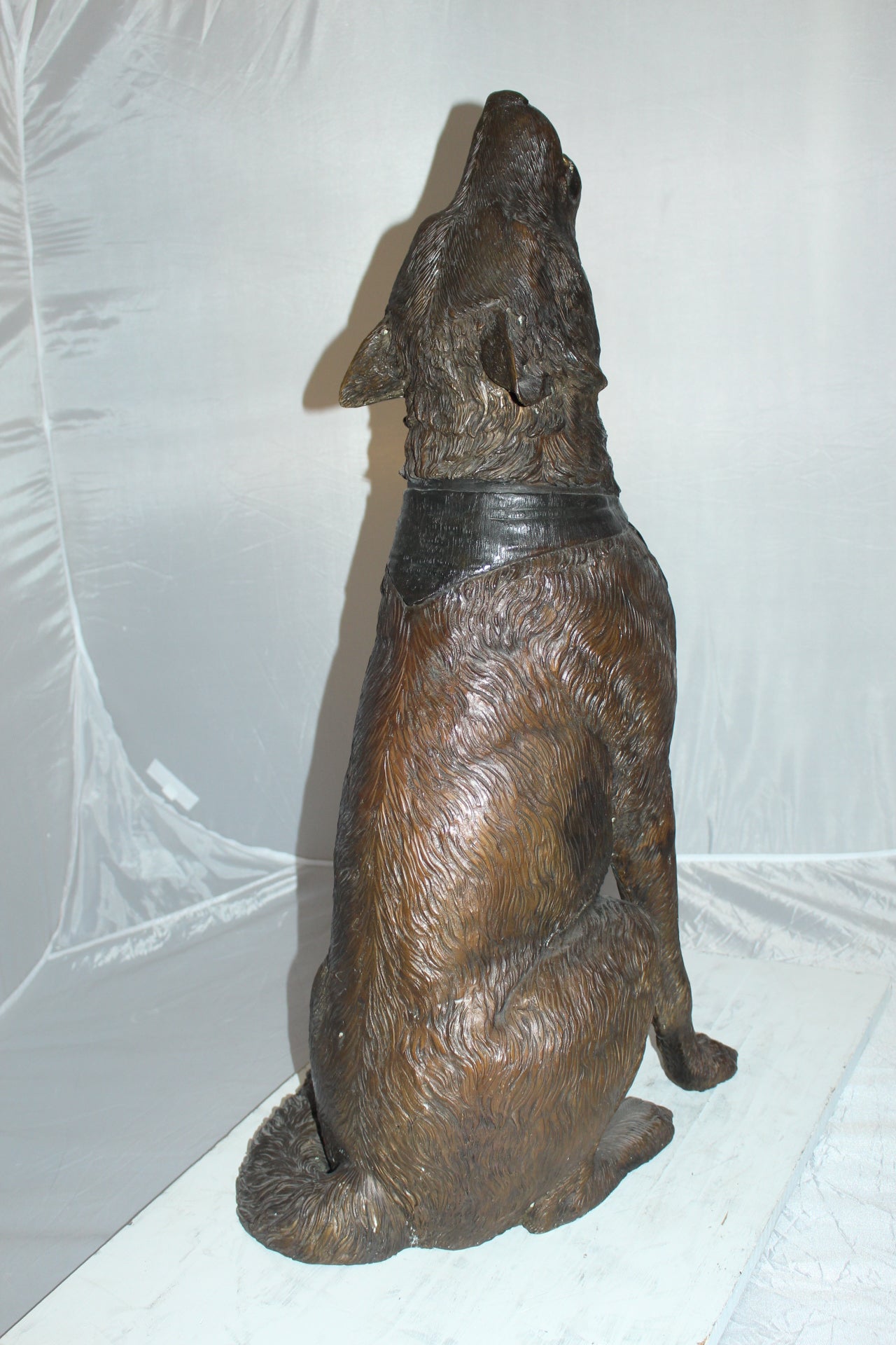 Howling Wolf Bronze Statue -  Size: 16"L x 20"W x 37"H. 