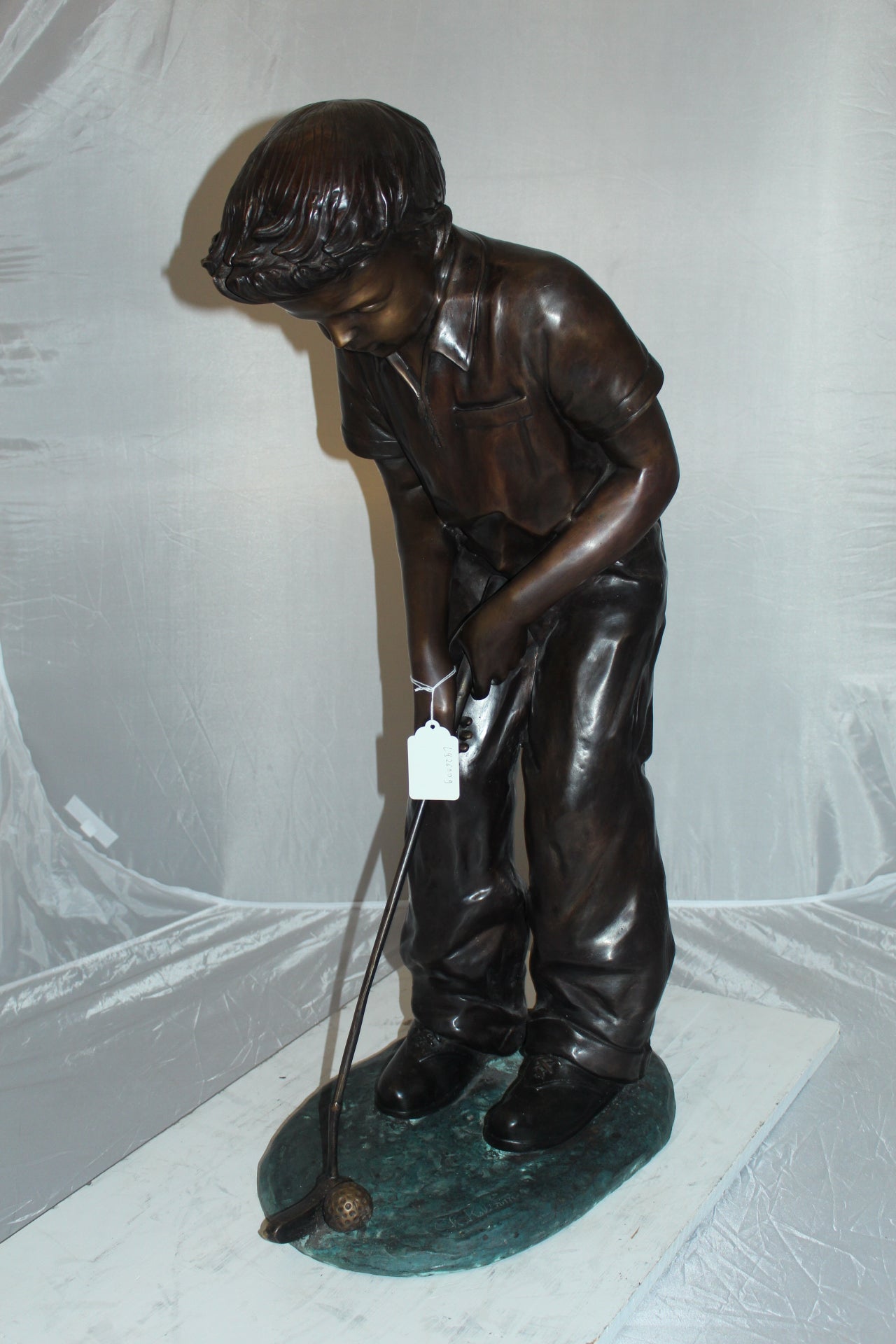 Boy plays golf Bronze Statue -  Size: 14"L x 18"W x 37"H. 