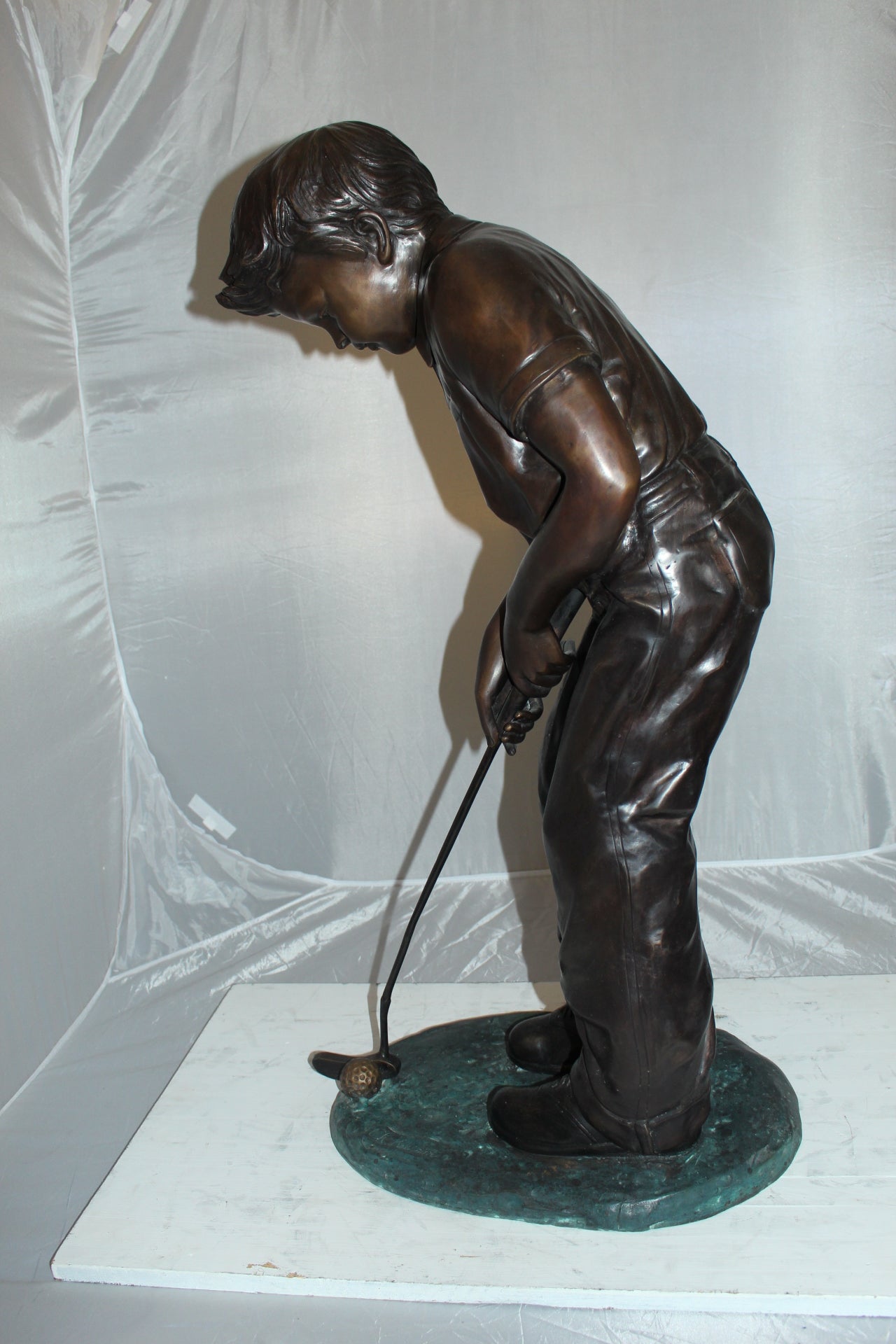 Boy plays golf Bronze Statue -  Size: 14"L x 18"W x 37"H. 