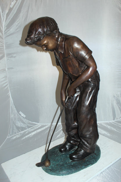 Boy plays golf Bronze Statue -  Size: 14"L x 18"W x 37"H. 