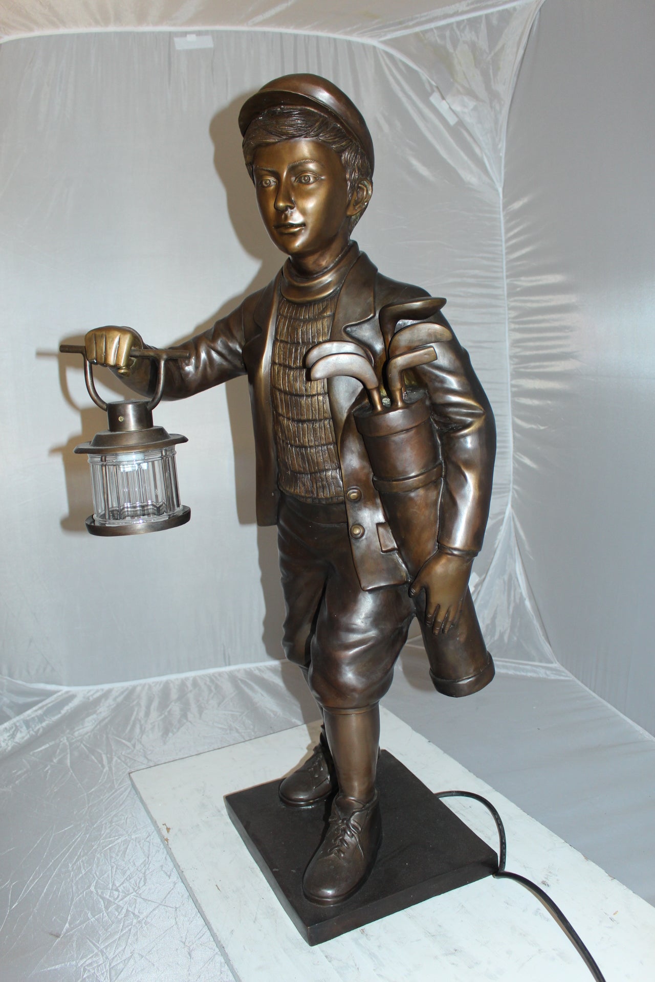 Caddy with light Bronze Statue -  Size: 19"L x 19"W x 42"H. 