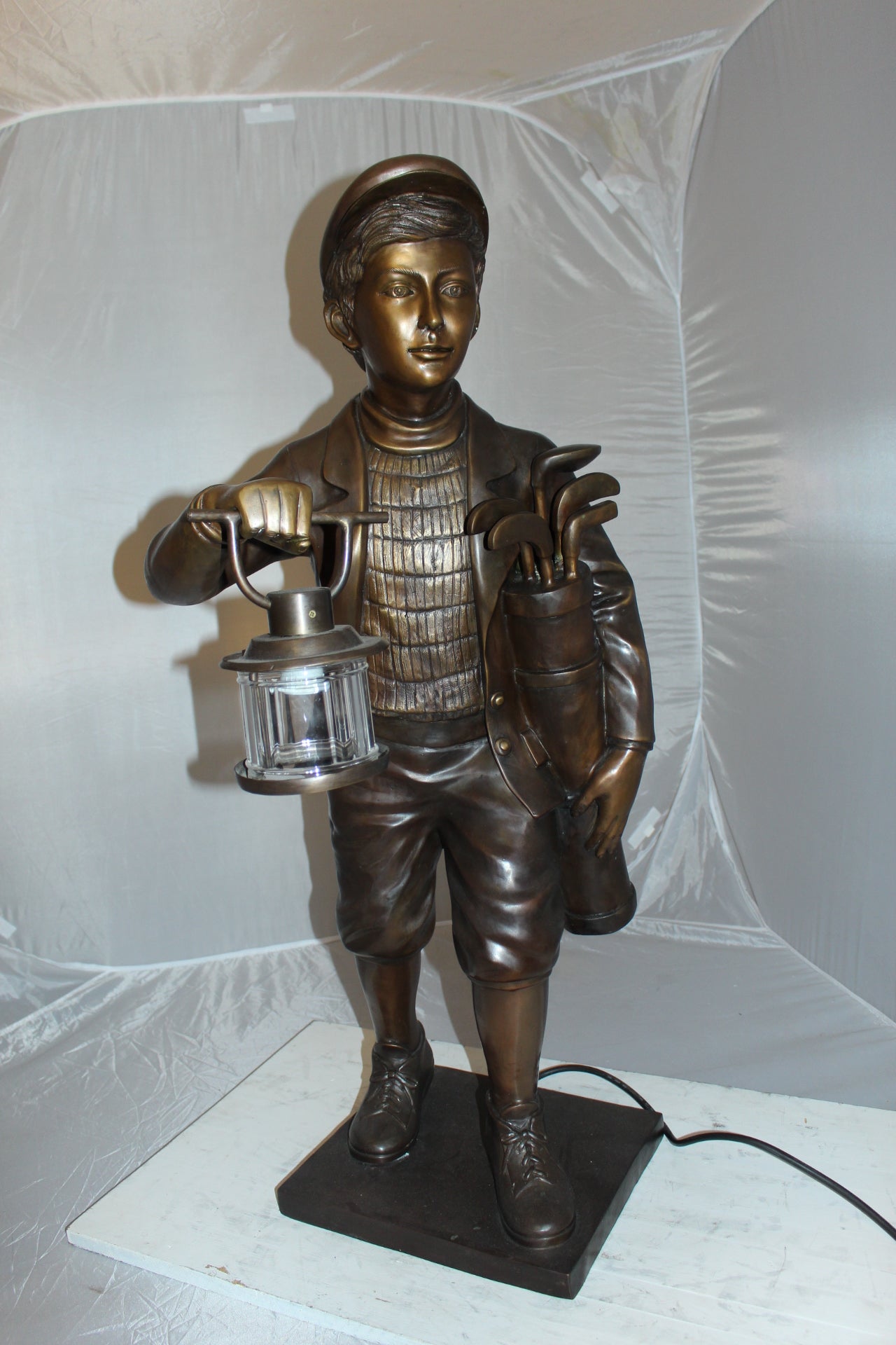 Caddy with light Bronze Statue -  Size: 19"L x 19"W x 42"H. 