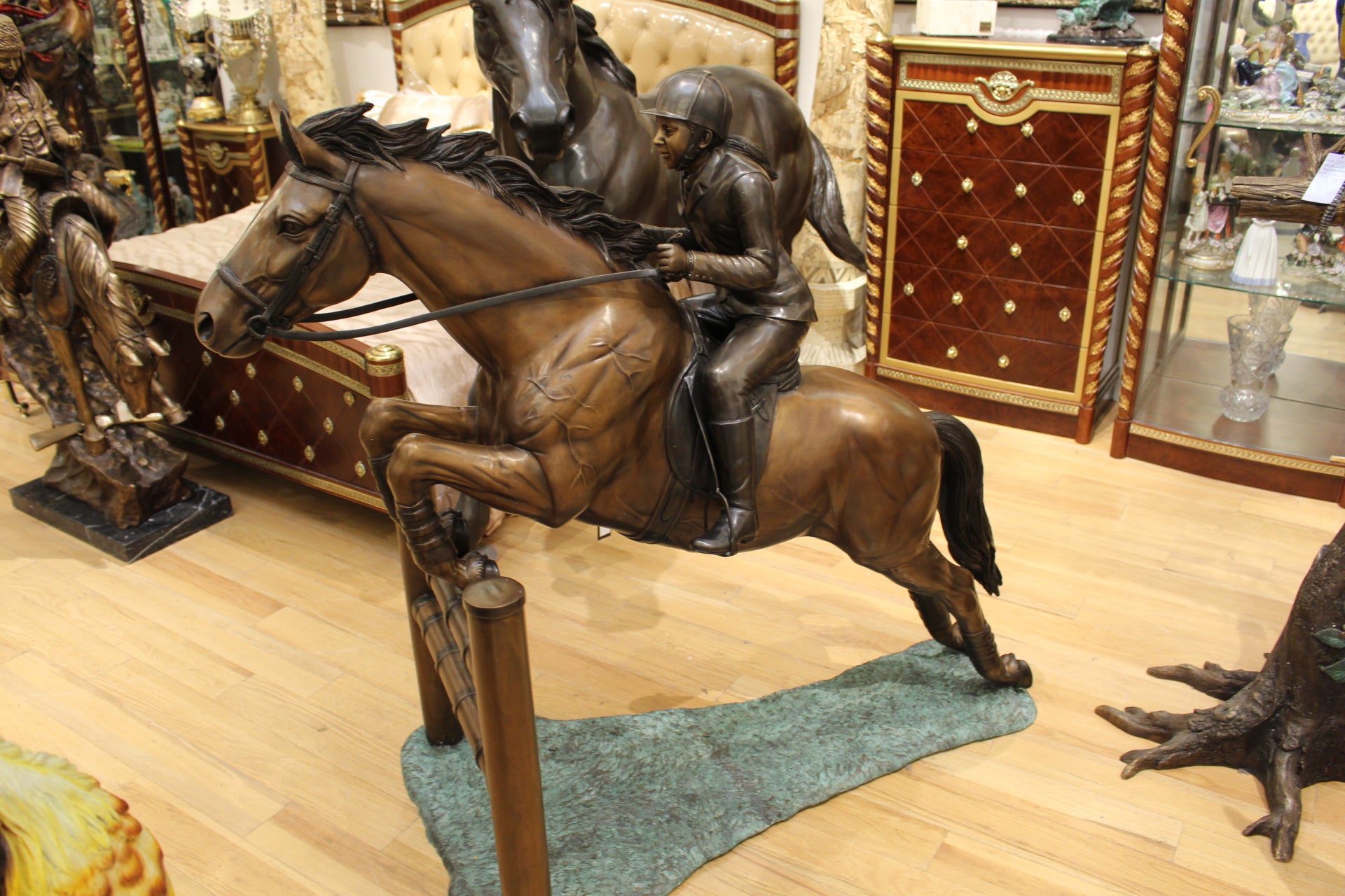 Jockey and Horse Jump a Fence Bronze Statue -  Size: 60"L x 30"W x 51"H. 