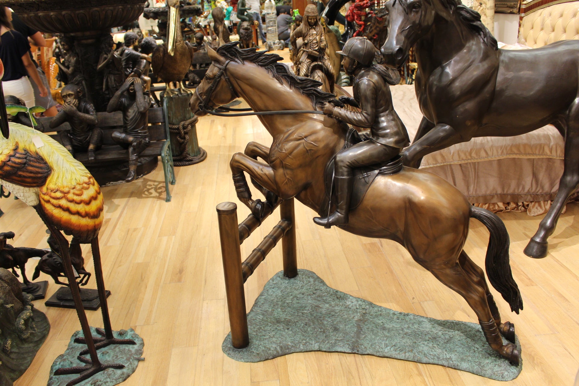 Jockey and Horse Jump a Fence Bronze Statue -  Size: 60"L x 30"W x 51"H. 