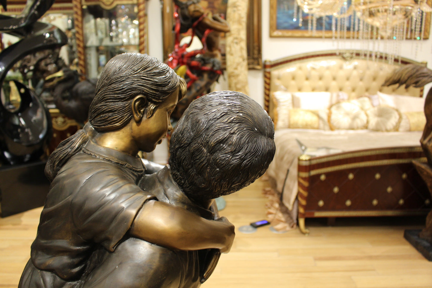 Boy Giving Girl Piggyback Ride Bronze Statue -  Size: 23"L x 16"W x 46"H. 