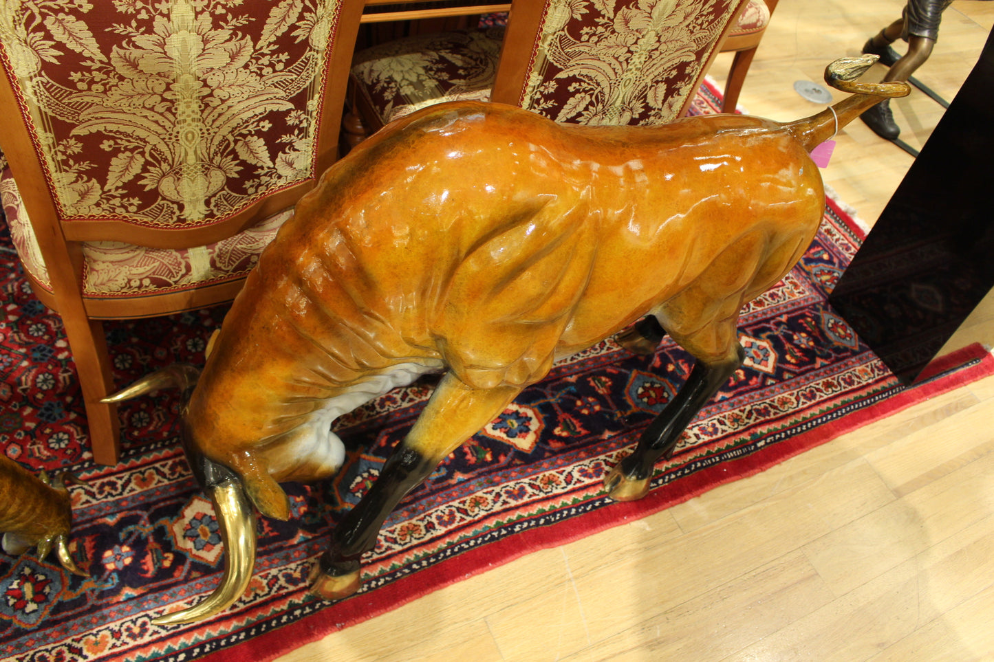 Bull Heads Down -Large Bronze Statue -  Size: 48"L x 12"W x 30"H. 