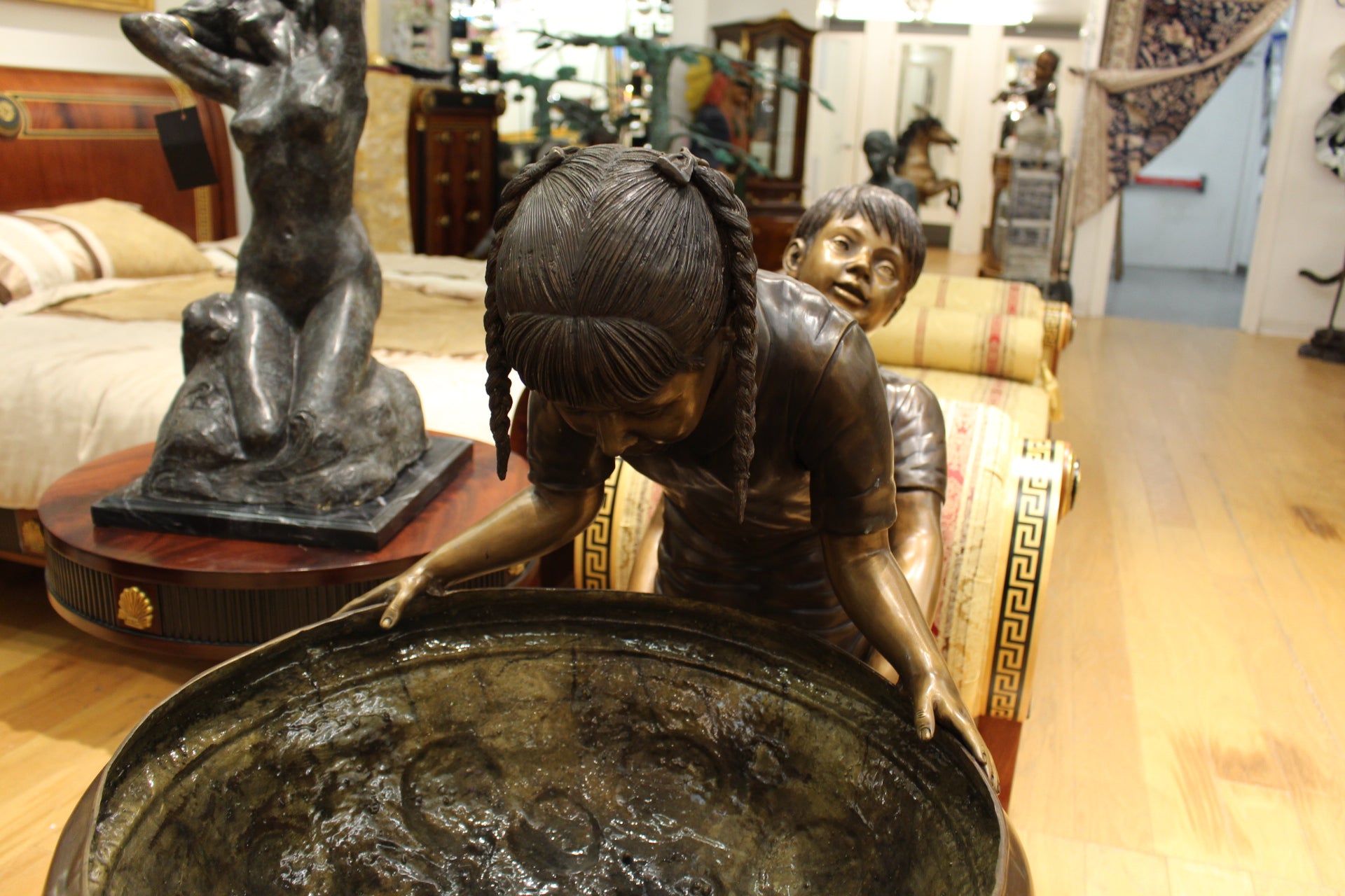 Boy Girl Drinking From Fountain Bronze Statue -  Size: 44"L x 24"W x 42"H. 
