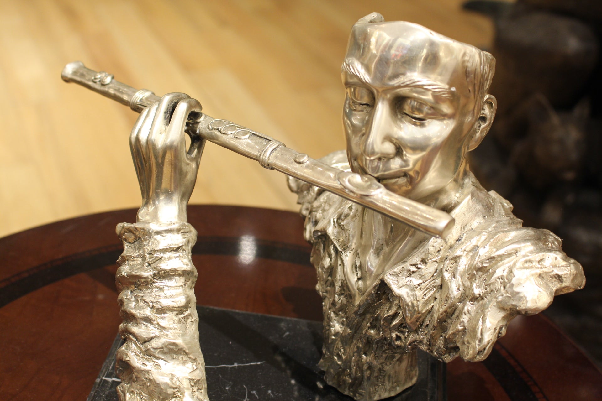 Man playing Flute Bronze Statue -  Size: 10"L x 8"W x 10"H. 