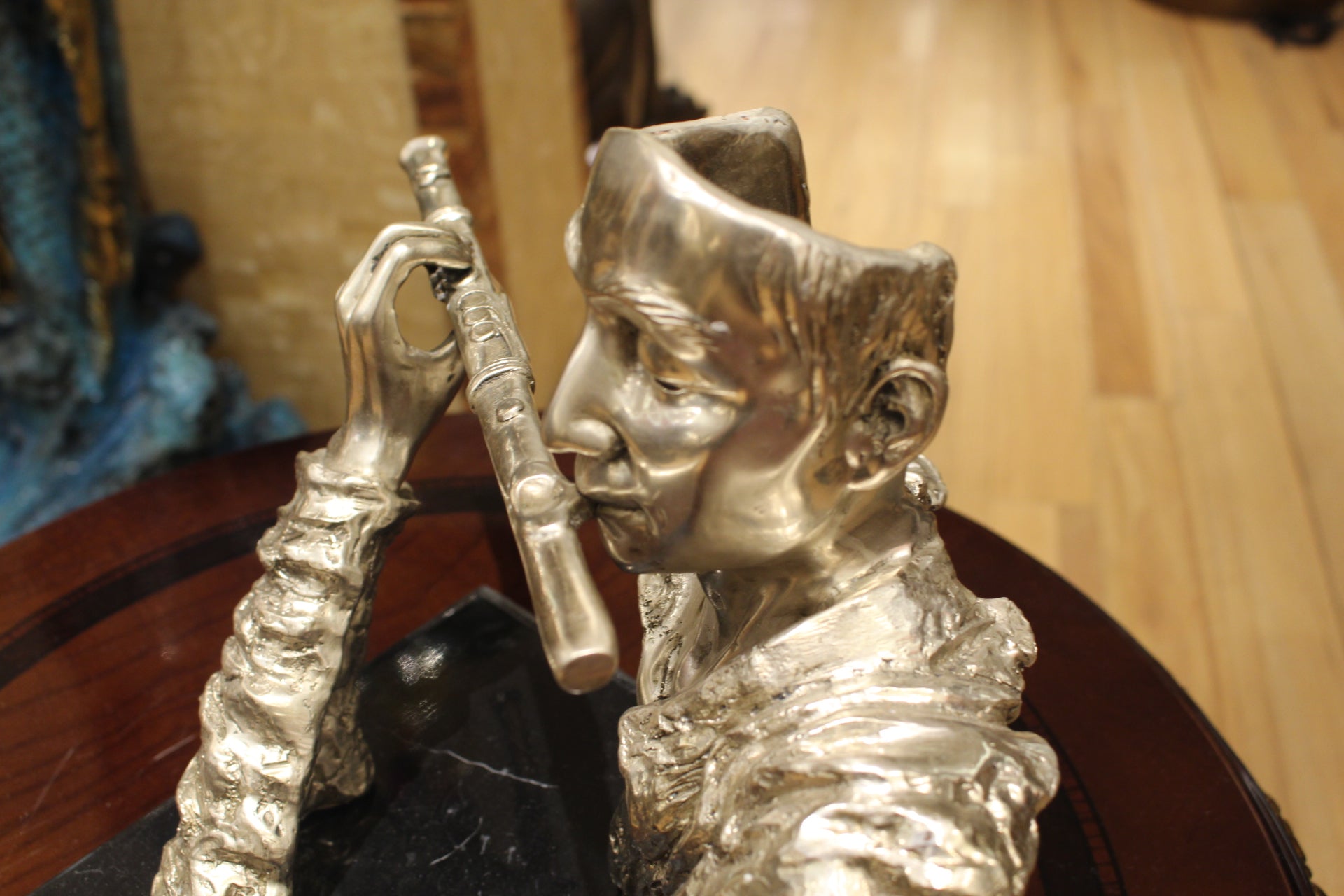 Man playing Flute Bronze Statue -  Size: 10"L x 8"W x 10"H. 