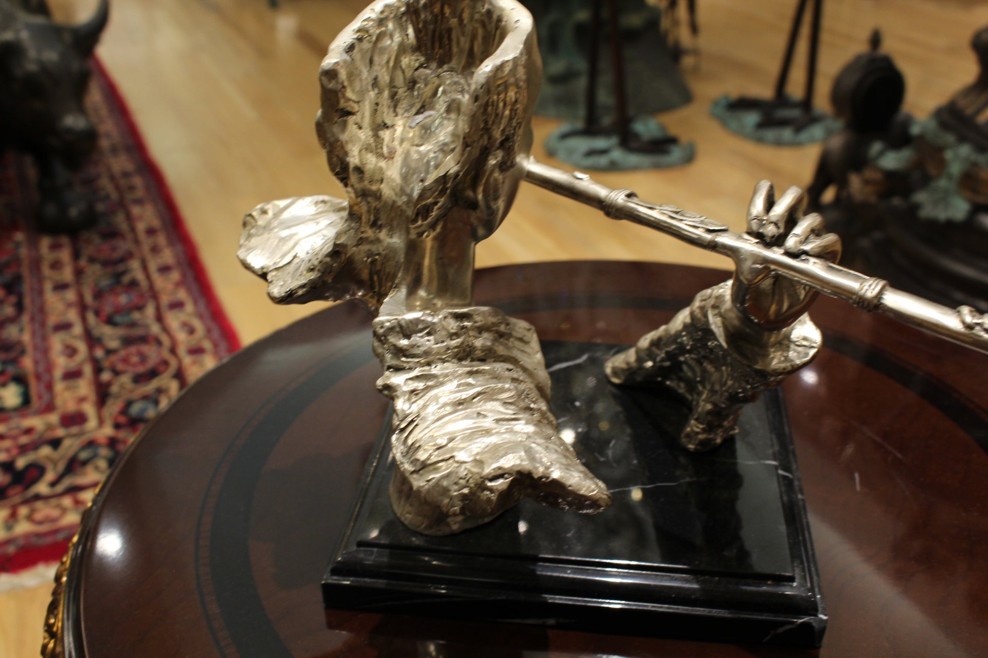 Man playing Flute Bronze Statue -  Size: 10"L x 8"W x 10"H. 