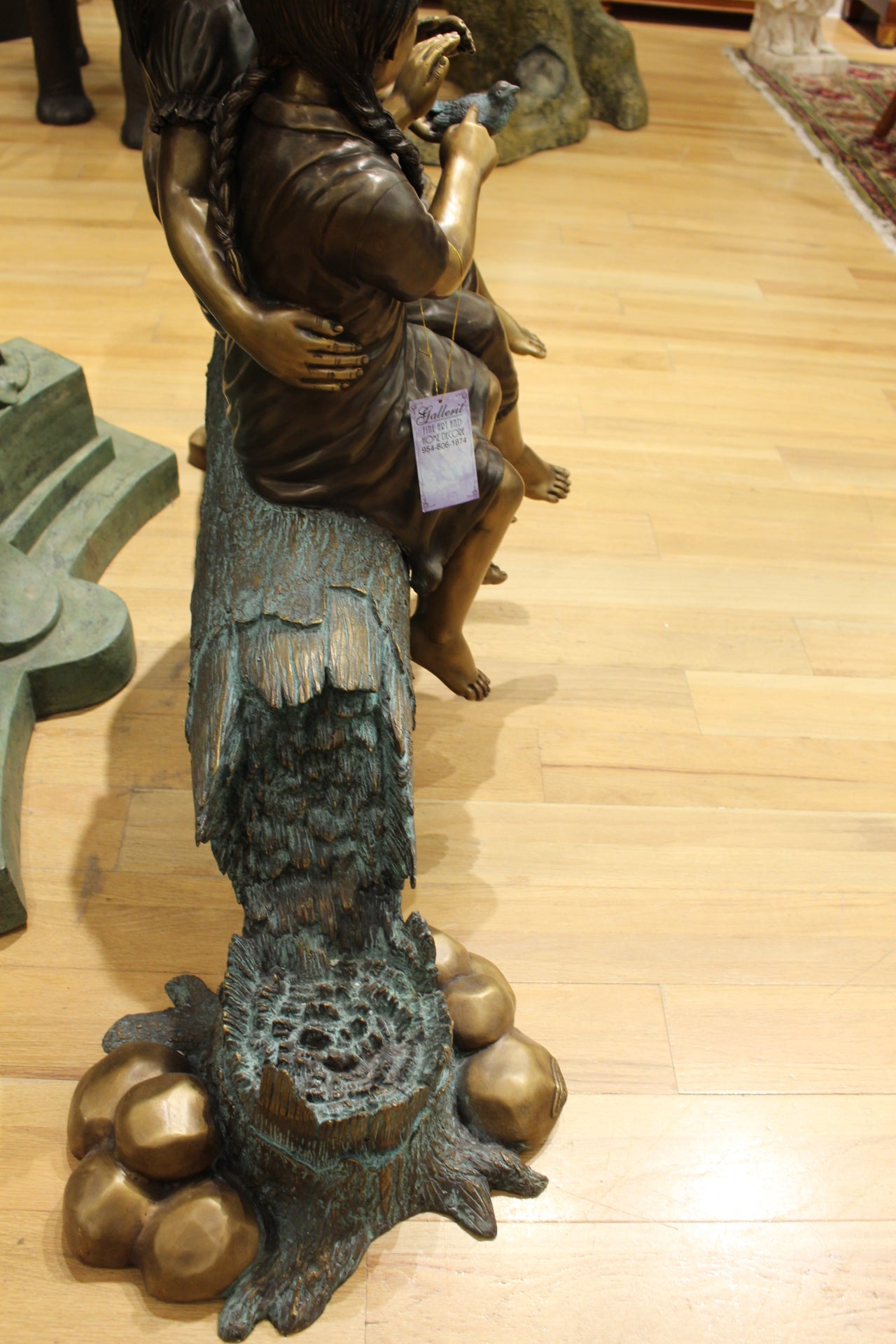 Three Children On Log Holding Bird Bronze Statue -  Size: 55"L x 18"W x 38"H. 