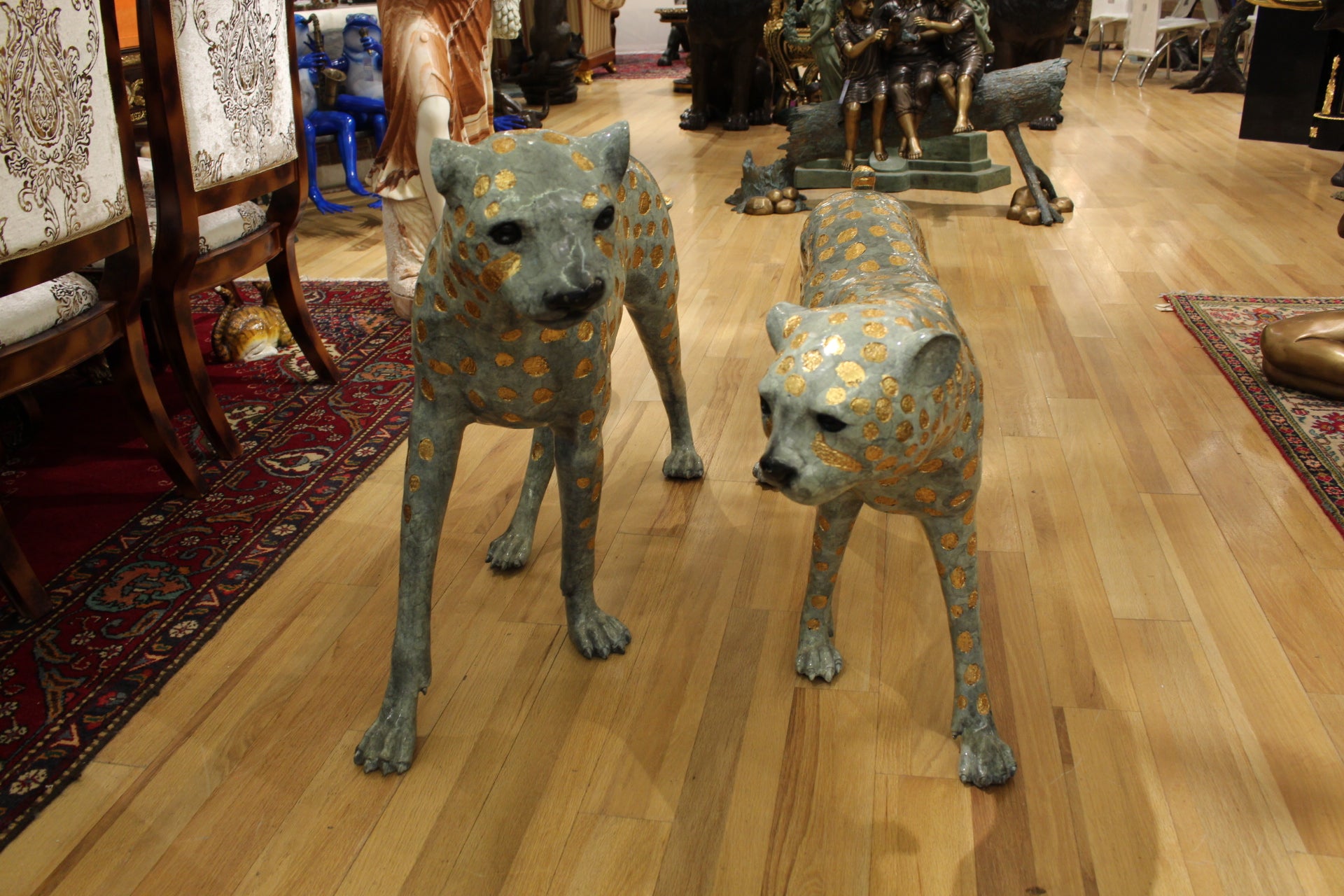 Pair of Golden-Plated Cheetahs Bronze Statue -  Size: 58"L x 10"W x 31"H. 