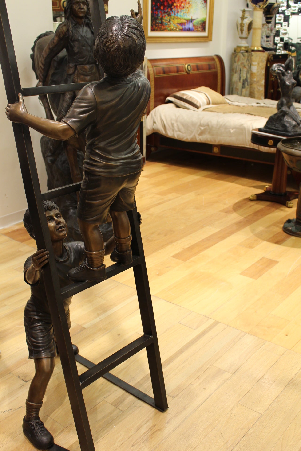 Three Children Playing on Ladder Bronze Statue -  Size: 24"L x 27"W x 96"H. 