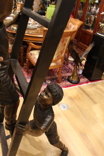 Three Children Playing on Ladder Bronze Statue -  Size: 24"L x 27"W x 96"H. 