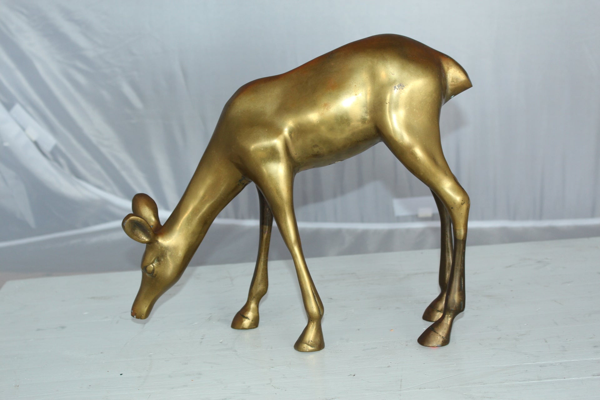 Two Tone color deer bronze statue -  Size: 13"L x 4"W x 11"H. 