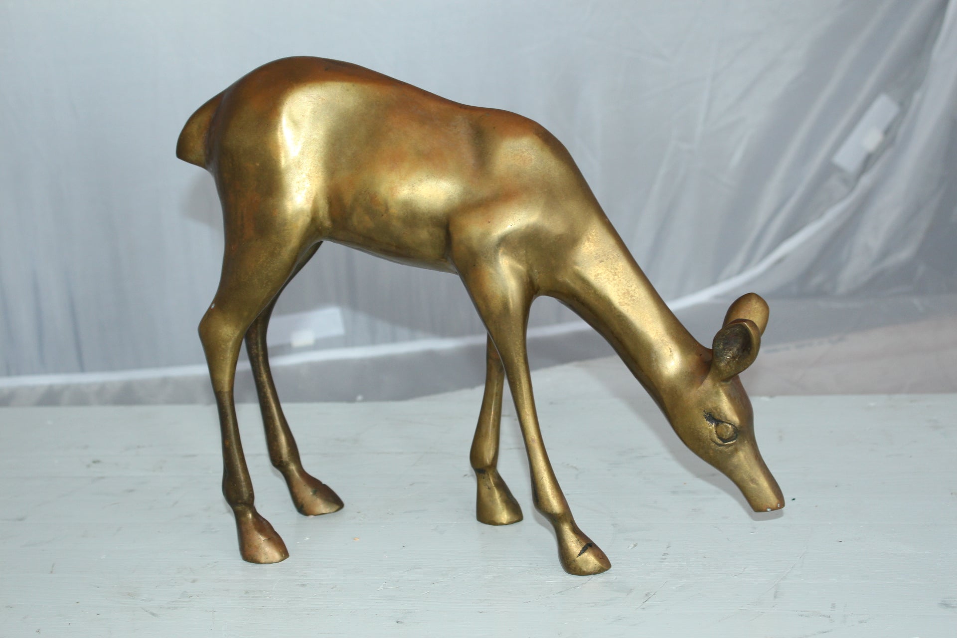 Two Tone color deer bronze statue -  Size: 13"L x 4"W x 11"H. 