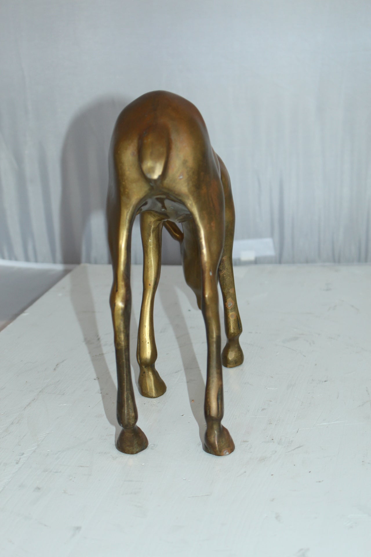 Two Tone color deer bronze statue -  Size: 13"L x 4"W x 11"H. 