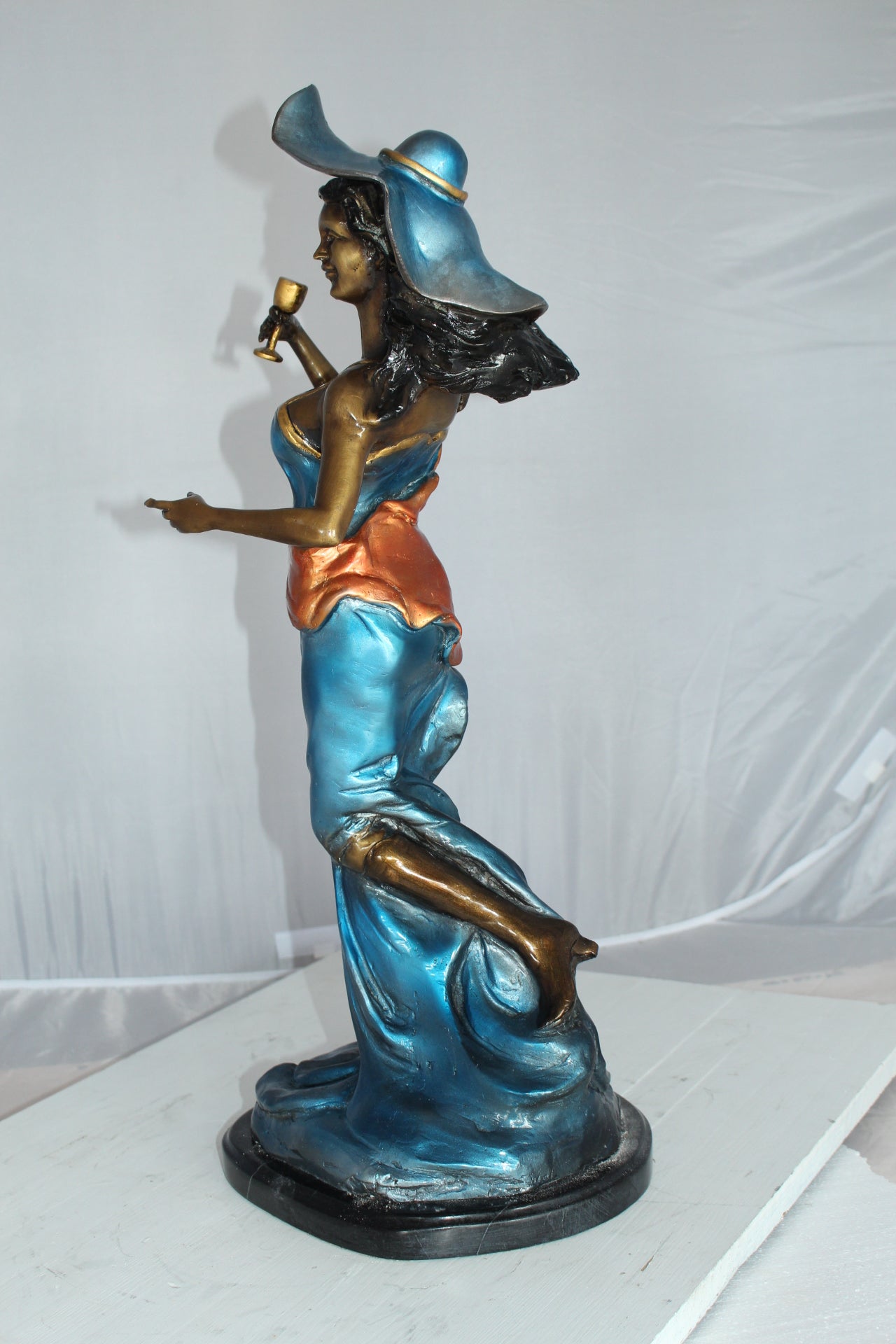 Lady Holding a Wine Glass Bronze Statue -  Size: 9"L x 11"W x 26"H. 